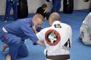 Alex 'rolling' with a partner during a BJJ seminar