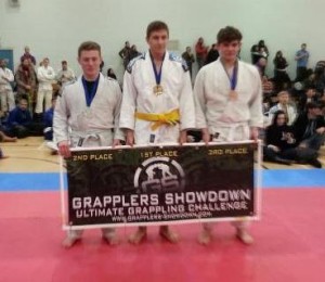 Gold medalist George (centre) and Silver Medalist Josh (left) win Crawley's BJJ Team their first medals of the day