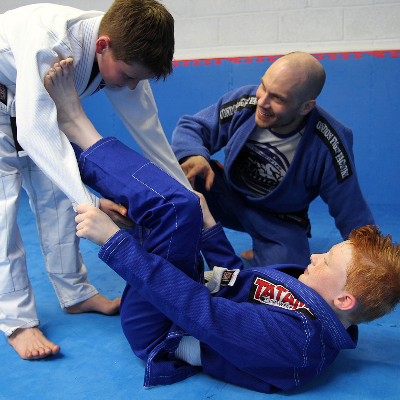 Brad and Jack learn a new technique under Black Belt Supervision